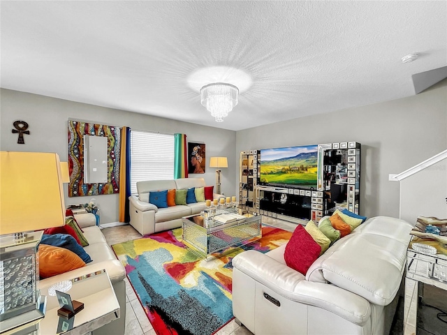 tiled living room with a chandelier and a textured ceiling