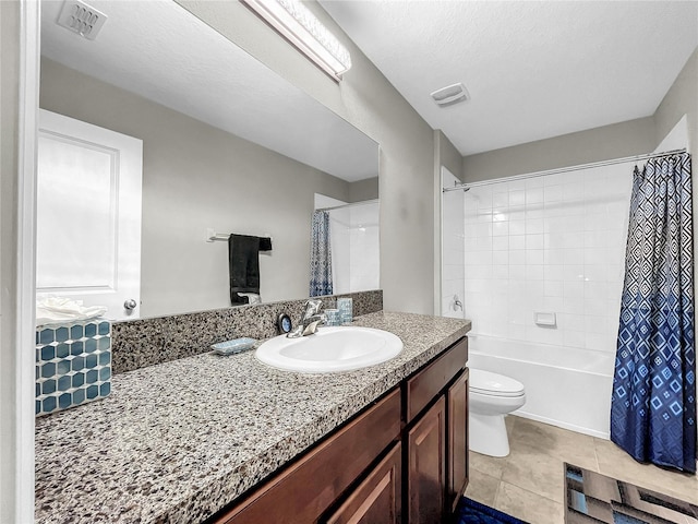 full bathroom featuring tile patterned flooring, a textured ceiling, shower / bathtub combination with curtain, vanity, and toilet