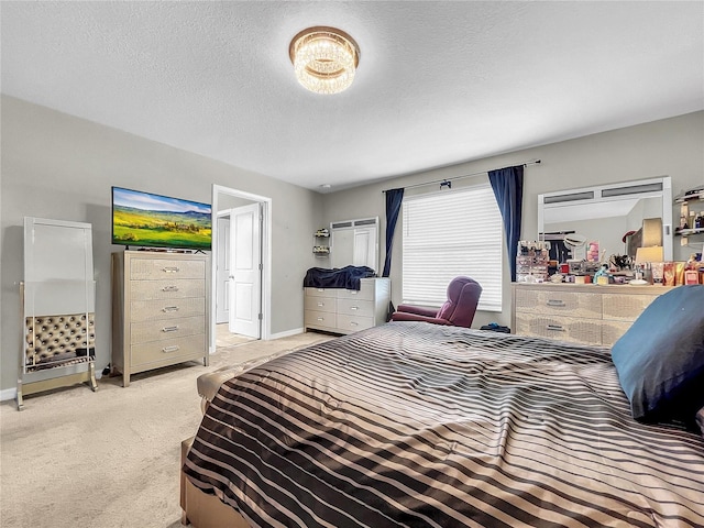 carpeted bedroom with a textured ceiling