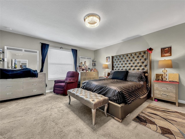 carpeted bedroom featuring a textured ceiling