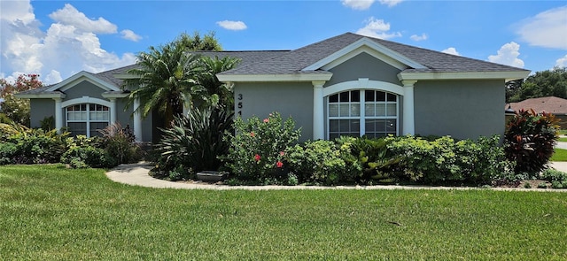 view of front of home with a front lawn