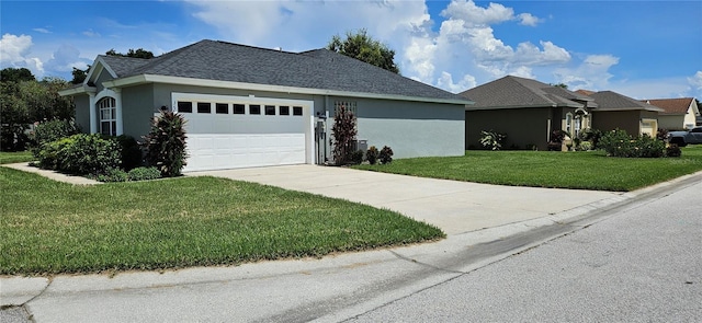 view of front of house with a garage and a front yard