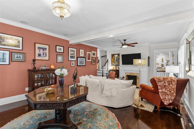 living room with hardwood / wood-style flooring, ornamental molding, ceiling fan, and beamed ceiling