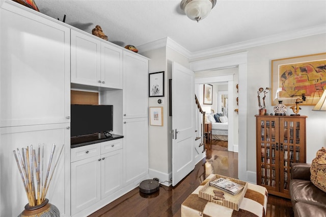 living room with crown molding and dark hardwood / wood-style floors