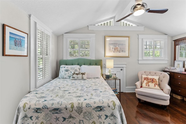 bedroom with lofted ceiling with beams, dark wood-type flooring, a textured ceiling, and ceiling fan