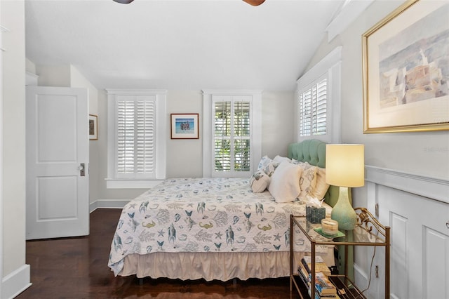 bedroom with lofted ceiling, dark hardwood / wood-style flooring, and ceiling fan