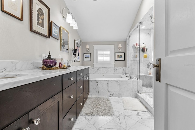 bathroom featuring lofted ceiling, independent shower and bath, and vanity