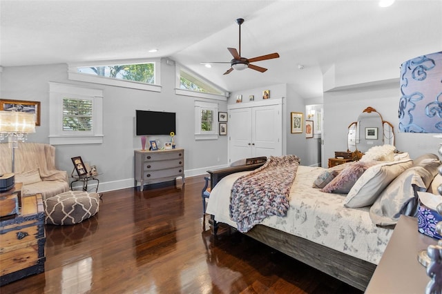 bedroom featuring ceiling fan, dark hardwood / wood-style floors, vaulted ceiling, and a closet