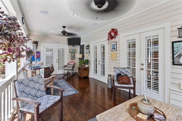 interior space with french doors and ceiling fan