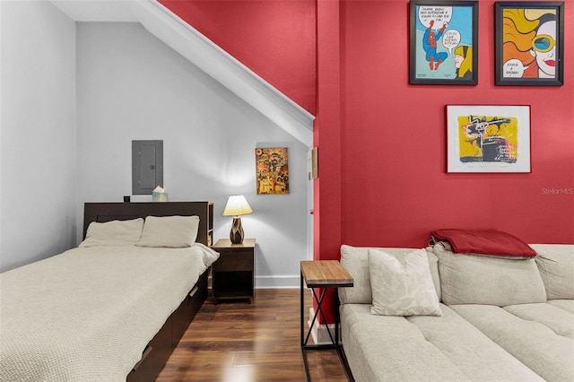 bedroom featuring dark wood-type flooring and electric panel