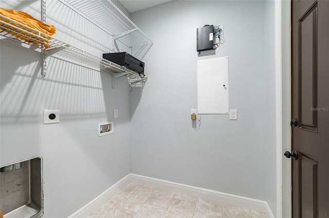 laundry area with washer hookup, hookup for an electric dryer, and light tile patterned flooring