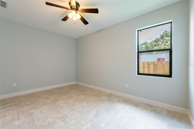 spare room with ceiling fan