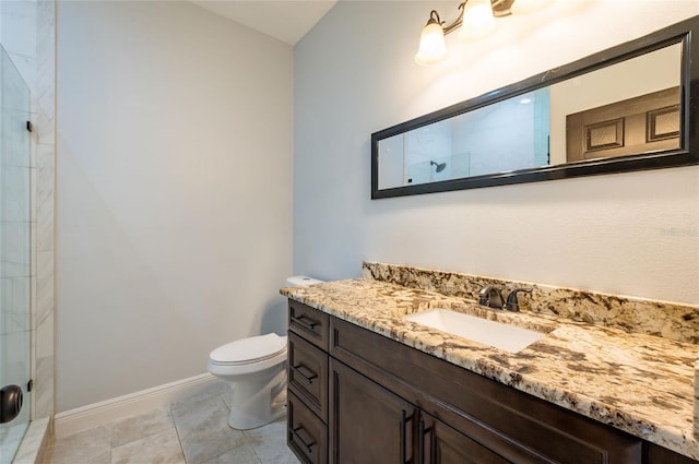 bathroom with toilet, an enclosed shower, tile patterned floors, and vanity