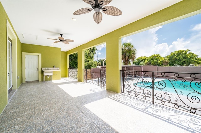 exterior space featuring ceiling fan