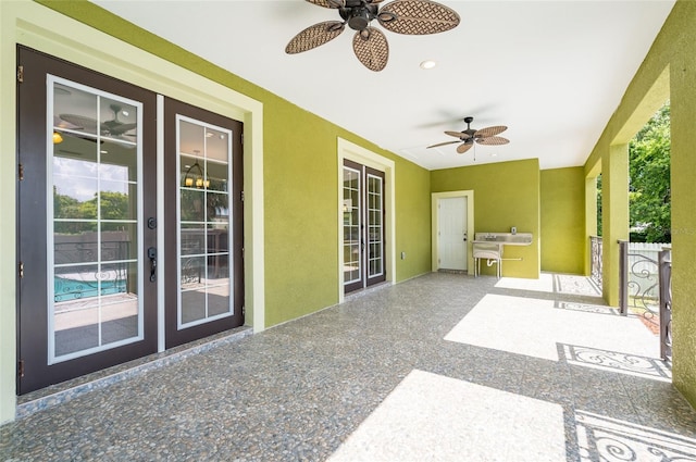 view of patio with ceiling fan and french doors