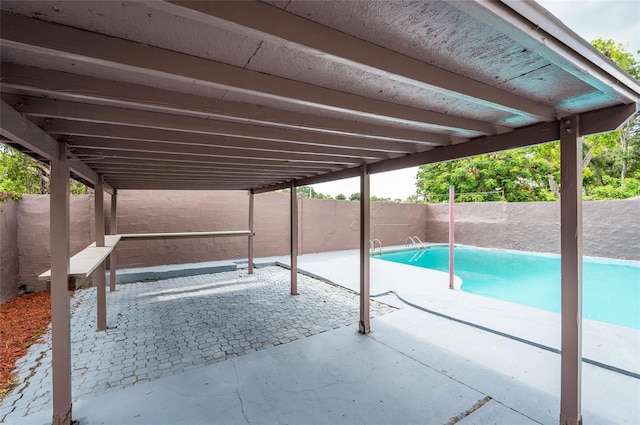 view of swimming pool with a patio area