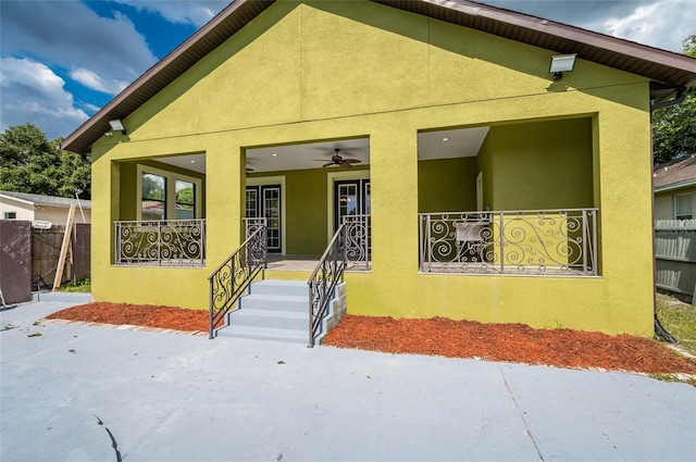 view of front of home with ceiling fan and a porch