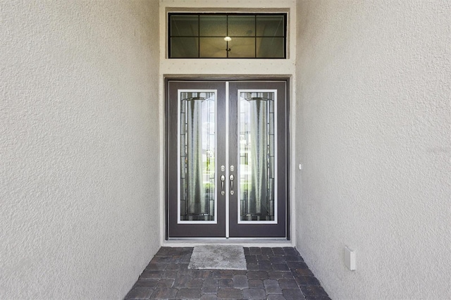 entrance to property featuring french doors