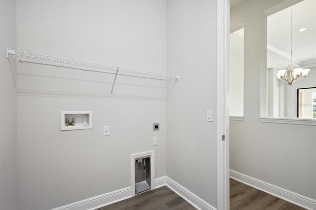 clothes washing area featuring hookup for an electric dryer, a notable chandelier, washer hookup, and dark hardwood / wood-style flooring