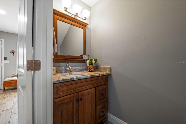 bathroom with hardwood / wood-style flooring and vanity