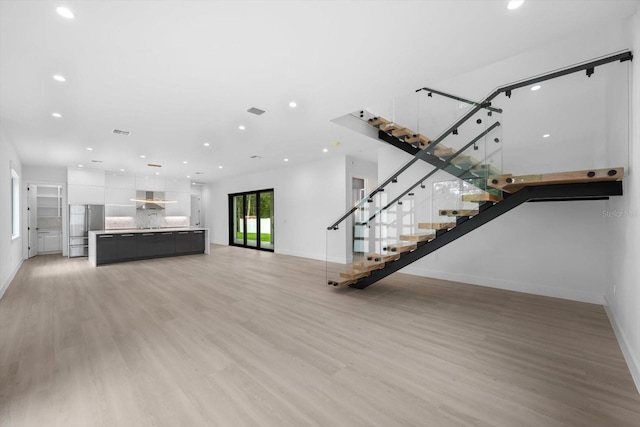 unfurnished living room featuring hardwood / wood-style floors