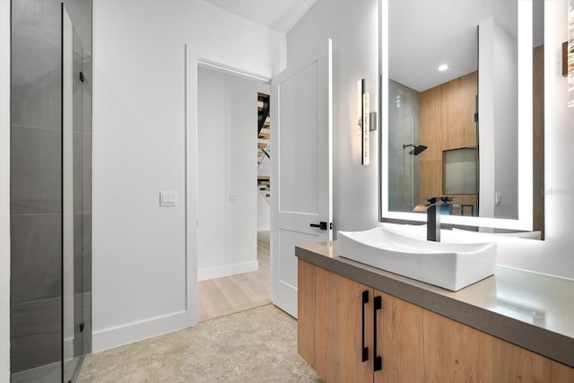 bathroom with a shower and vanity