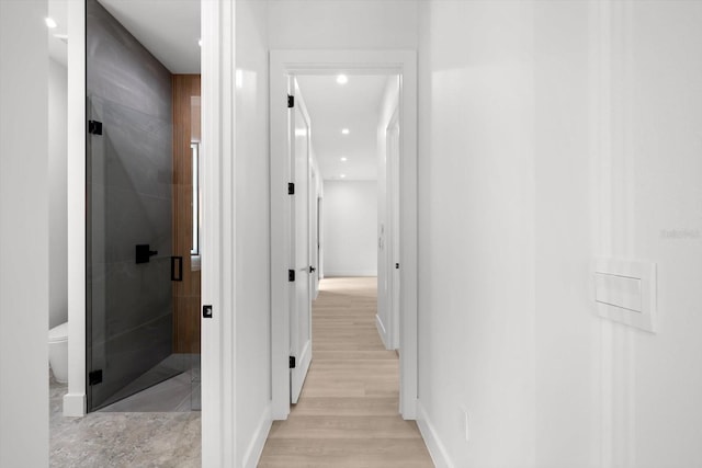 corridor featuring light hardwood / wood-style floors