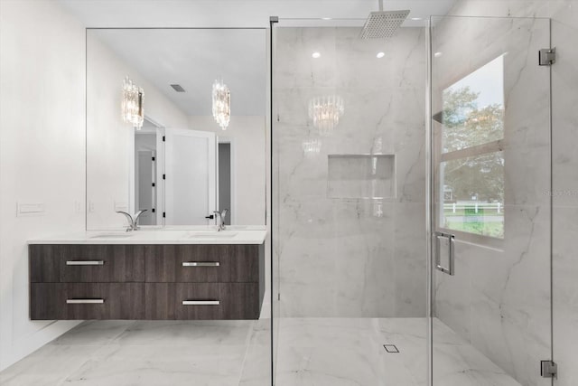 bathroom with an enclosed shower and vanity