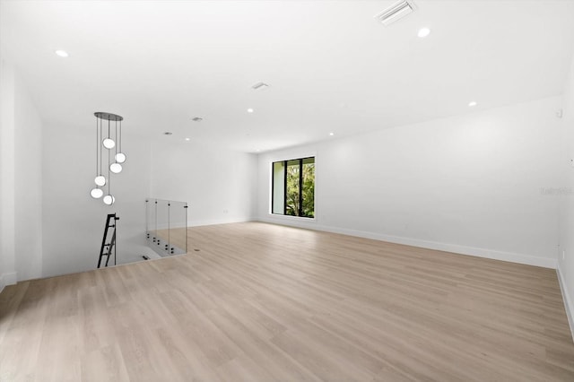 empty room with light hardwood / wood-style floors