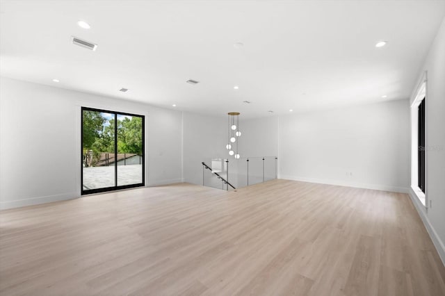 empty room with light hardwood / wood-style floors