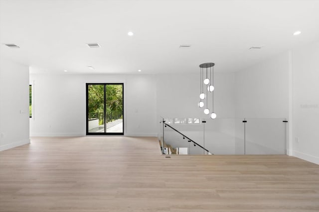 unfurnished room with light hardwood / wood-style flooring