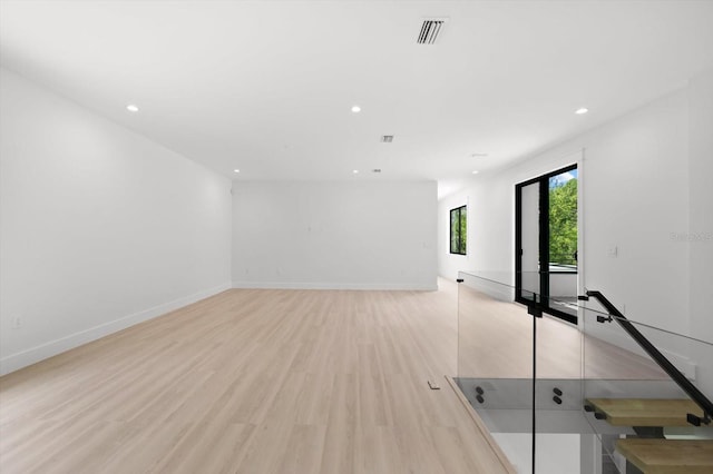 unfurnished room featuring light hardwood / wood-style floors