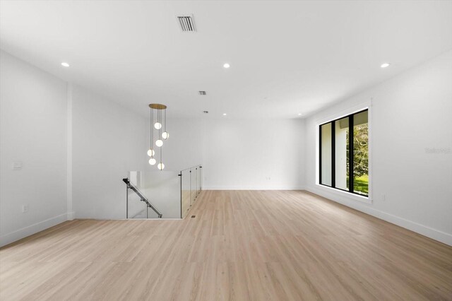 unfurnished room with light hardwood / wood-style floors