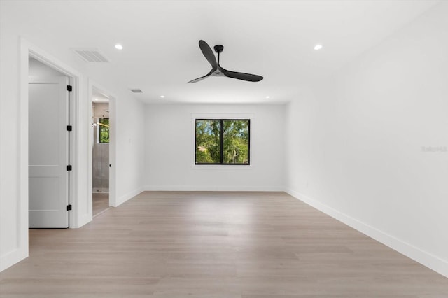 spare room featuring ceiling fan and light hardwood / wood-style floors