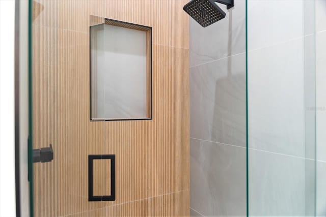 bathroom featuring an enclosed shower