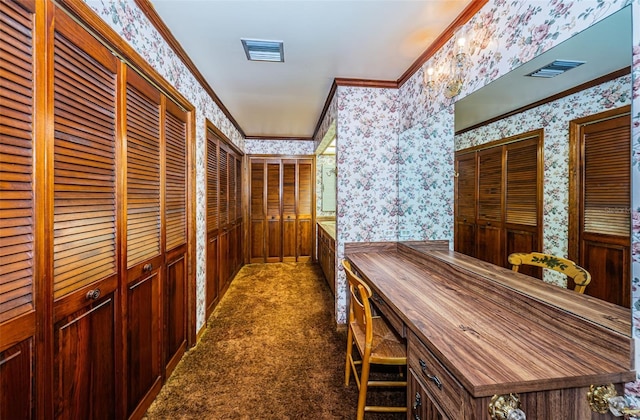 hall featuring crown molding and dark carpet