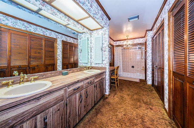 bathroom with vanity, a notable chandelier, crown molding, and walk in shower