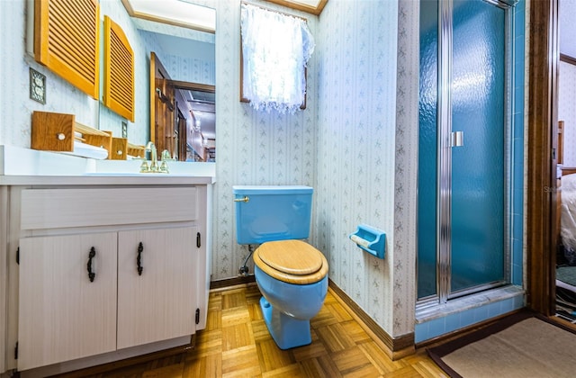 bathroom featuring vanity, parquet floors, toilet, and walk in shower