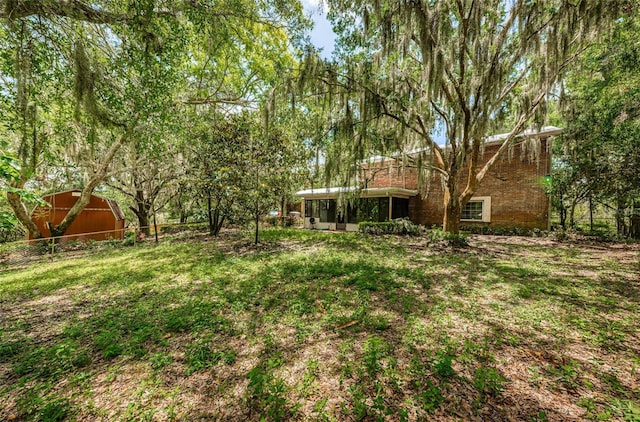 view of yard featuring a sunroom