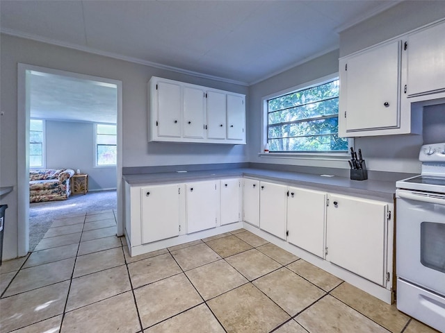 kitchen featuring white cabinetry, light tile patterned floors, crown molding, and white range with electric cooktop