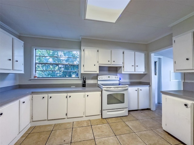 kitchen featuring crown molding, light tile patterned flooring, white cabinets, and white range with electric stovetop