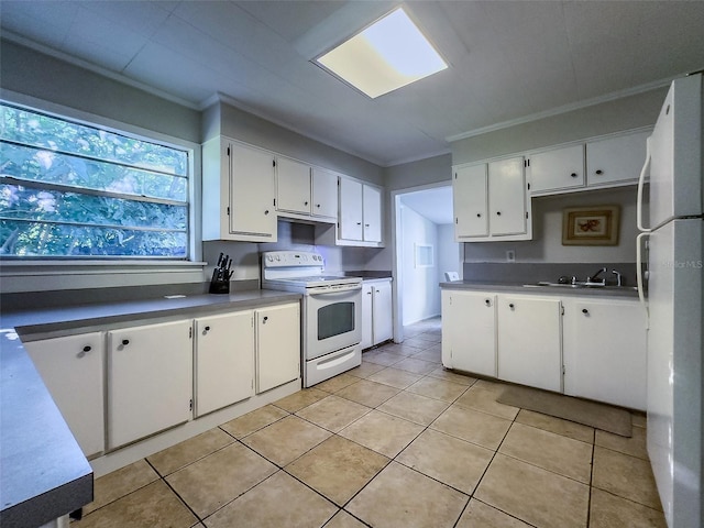 kitchen with sink, white appliances, ornamental molding, white cabinets, and light tile patterned flooring