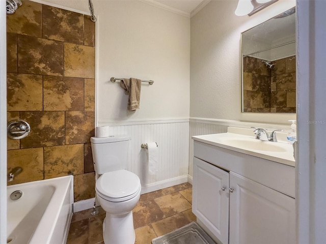 full bathroom featuring vanity, crown molding, tiled shower / bath combo, and toilet