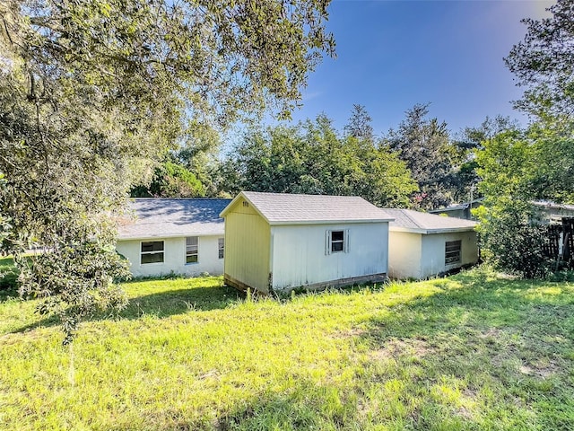 view of property exterior featuring a lawn