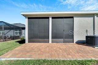 rear view of property featuring central AC