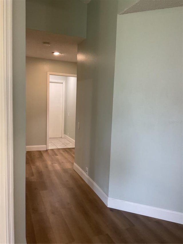 hallway featuring hardwood / wood-style flooring