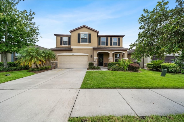 view of front facade with a garage and a front yard