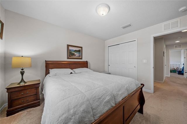 carpeted bedroom featuring a closet