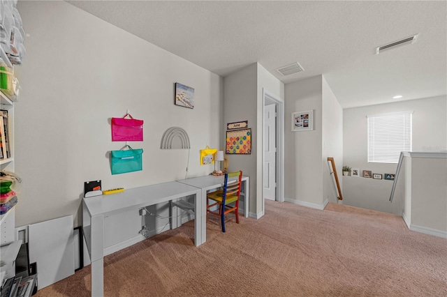 office with carpet flooring and a textured ceiling