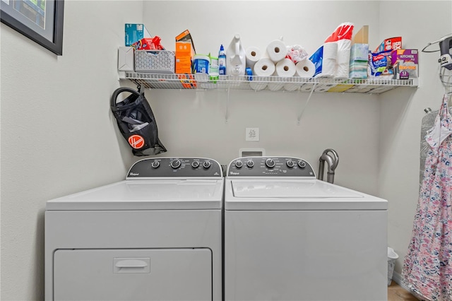 laundry area with independent washer and dryer